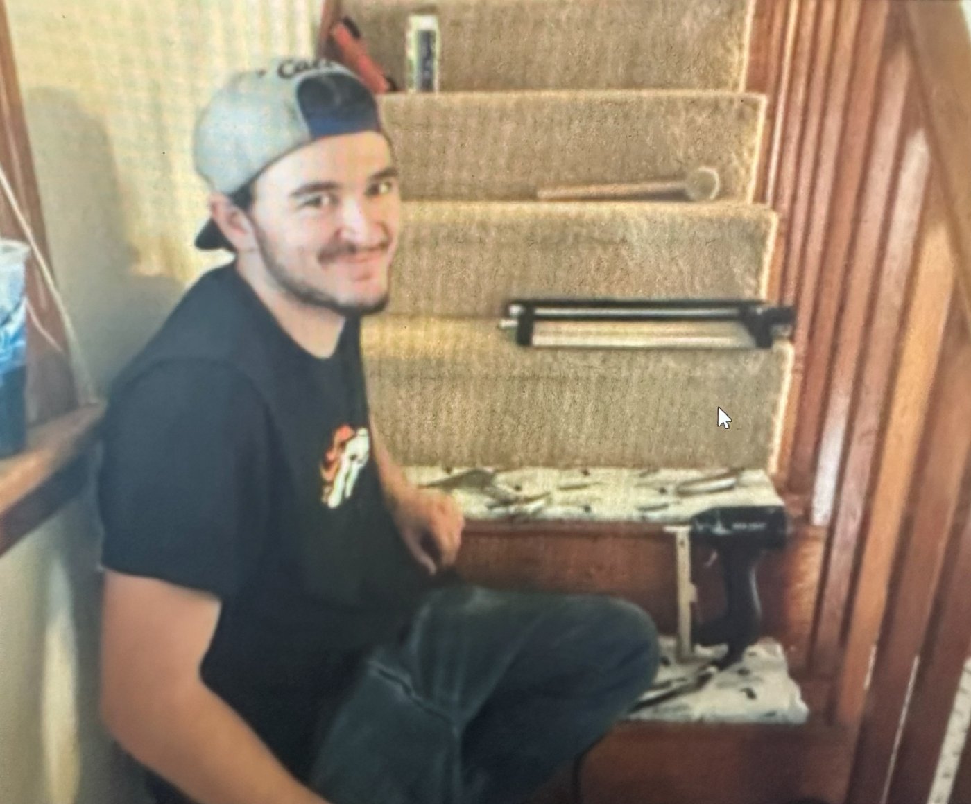 Aaron doing flooring on the stairs
